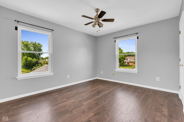 6329 Whitaker Farms Dr, Indianapolis, IN 46237 - spare room featuring dark wood finished floors and a ceiling fan