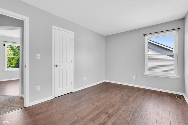 6329 Whitaker Farms Dr, Indianapolis, IN 46237 - empty room featuring dark wood-type flooring and baseboards