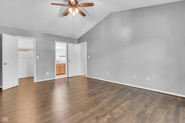 6329 Whitaker Farms Dr, Indianapolis, IN 46237 - unfurnished bedroom featuring vaulted ceiling, a walk in closet, dark wood-type flooring, ensuite bath, and a ceiling fan