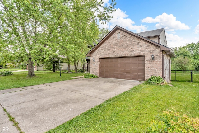 6329 Whitaker Farms Dr, Indianapolis, IN 46237 - view of side of property featuring brick siding, an attached garage, and concrete driveway