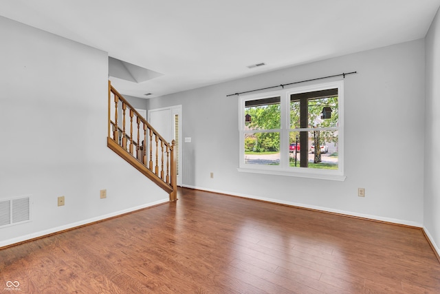 6329 Whitaker Farms Dr, Indianapolis, IN 46237 - unfurnished living room with stairs and wood finished floors