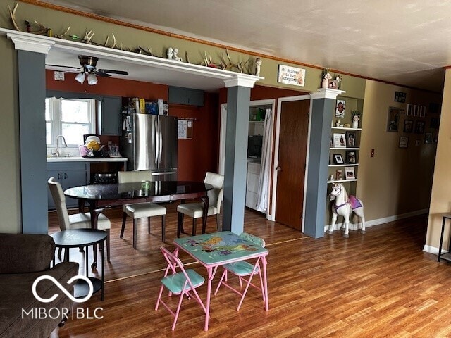 dining space featuring ceiling fan and wood finished floors