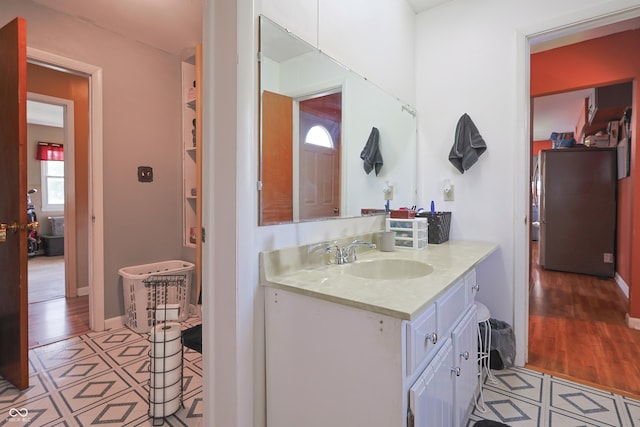 1014 Washington St, Hope, IN 47246 - bathroom featuring vanity and wood finished floors
