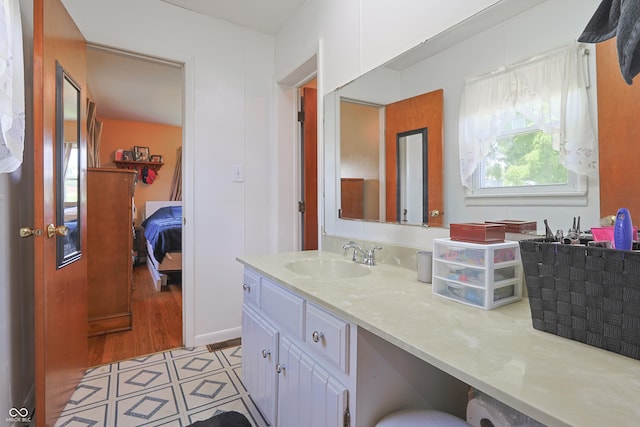 1014 Washington St, Hope, IN 47246 - ensuite bathroom with vanity and tile patterned floors