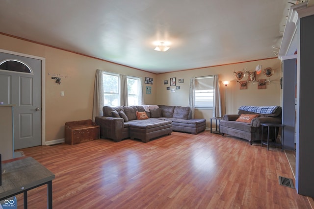 1014 Washington St, Hope, IN 47246 - living area featuring wood finished floors and crown molding