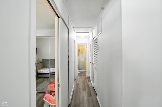 7307 Twin Beech Dr, Indianapolis, IN 46226 - corridor featuring wood finished floors and attic access