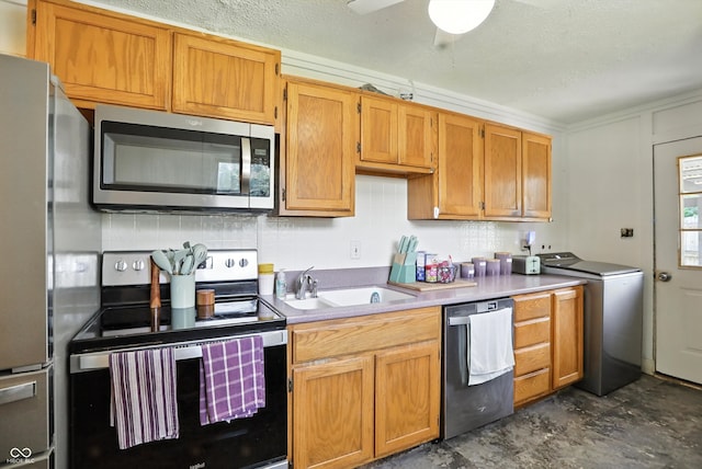7307 Twin Beech Dr, Indianapolis, IN 46226 - kitchen with stainless steel appliances, washer / clothes dryer, decorative backsplash, light countertops, and a textured ceiling