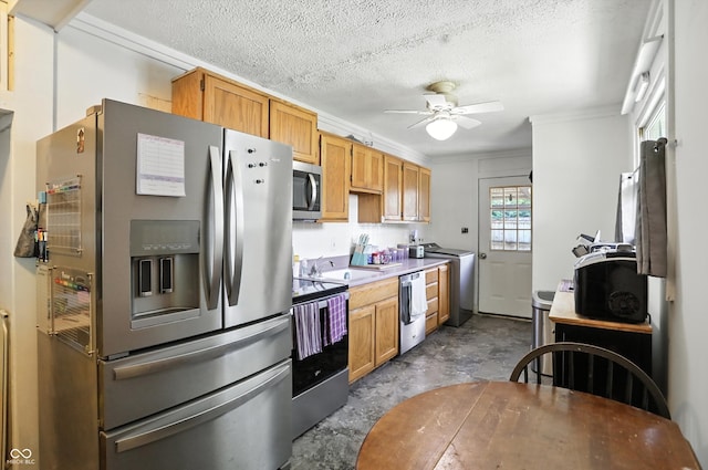 7307 Twin Beech Dr, Indianapolis, IN 46226 - kitchen featuring appliances with stainless steel finishes, a ceiling fan, ornamental molding, washer / dryer, and light countertops