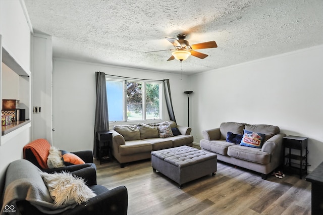 7307 Twin Beech Dr, Indianapolis, IN 46226 - living area featuring a textured ceiling, a ceiling fan, wood finished floors, and crown molding