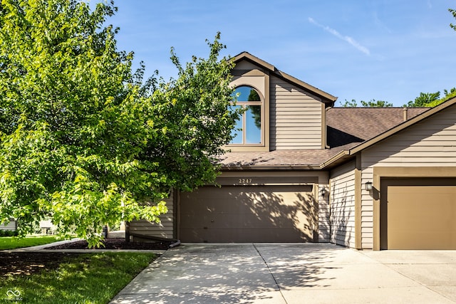 2247 Frisco Pl, Indianapolis, IN 46240 - view of front of property featuring concrete driveway, an attached garage, and roof with shingles