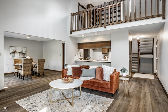 2247 Frisco Pl, Indianapolis, IN 46240 - living room featuring wood finished floors, stairs, and a high ceiling