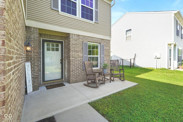 3075 W Crosscreek Dr, Monrovia, IN 46157 - view of exterior entry featuring brick siding and a patio area