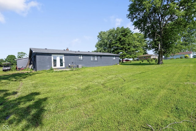 2911 N 200 W Rd, Franklin, IN 46131 - rear view of house with a lawn and brick siding