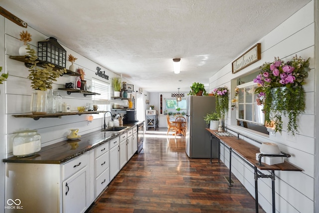 2911 N 200 W Rd, Franklin, IN 46131 - kitchen featuring open shelves, freestanding refrigerator, dark wood-style floors, a textured ceiling, and white cabinetry