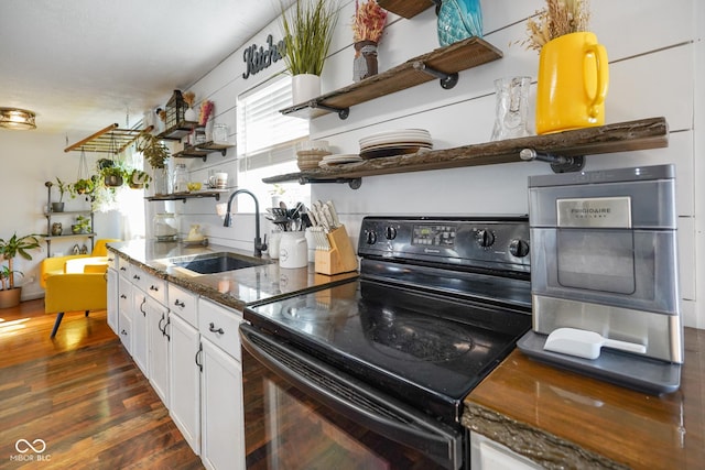 2911 N 200 W Rd, Franklin, IN 46131 - kitchen featuring black electric range, open shelves, dark stone countertops, white cabinetry, and dark wood-type flooring