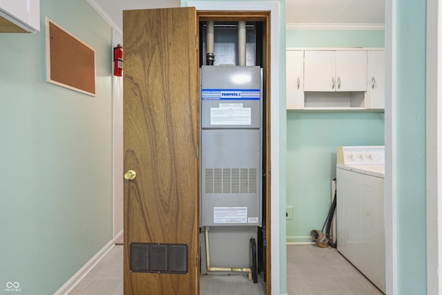 705 N Davidson St, Greensburg, IN 47240 - washroom with washer / dryer, ornamental molding, and cabinet space