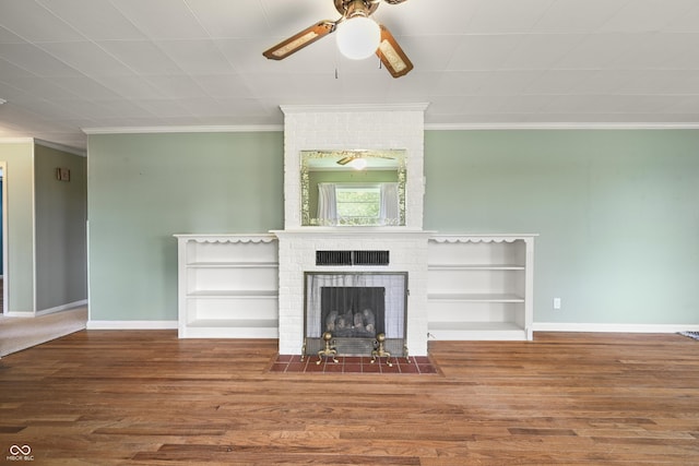 705 N Davidson St, Greensburg, IN 47240 - unfurnished living room with ornamental molding, a ceiling fan, wood finished floors, and a fireplace
