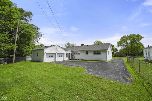 705 N Davidson St, Greensburg, IN 47240 - rear view of house featuring a chimney and asphalt driveway