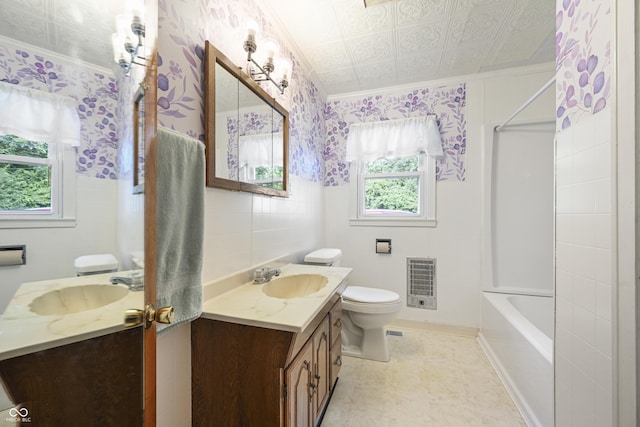 705 N Davidson St, Greensburg, IN 47240 - bathroom featuring vanity, ornamental molding, tile walls, heating unit, and an ornate ceiling