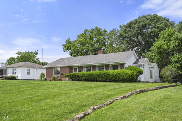 705 N Davidson St, Greensburg, IN 47240 - single story home featuring a front yard, a chimney, brick siding, and a shingled roof