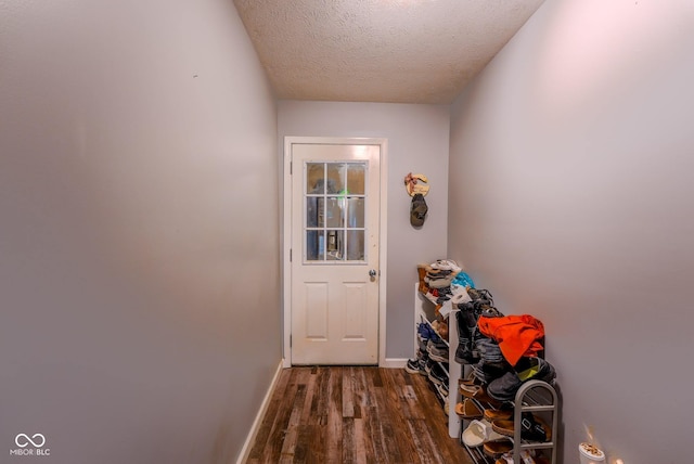 1905 W Brownstown Rd, North Vernon, IN 47265 - doorway to outside with wood finished floors and a textured ceiling