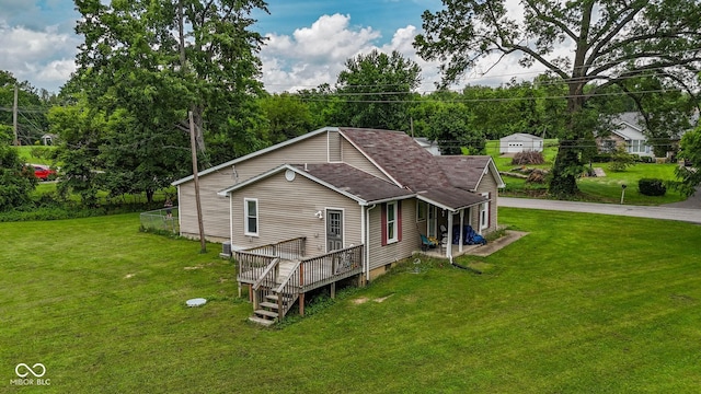 1905 W Brownstown Rd, North Vernon, IN 47265 - view of property exterior with a lawn, roof with shingles, and a deck