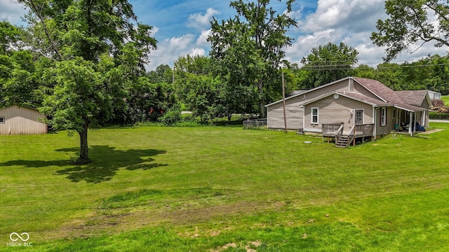 1905 W Brownstown Rd, North Vernon, IN 47265 - view of green lawn featuring a deck