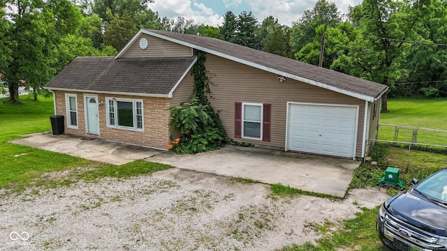 1905 W Brownstown Rd, North Vernon, IN 47265 - view of front of home with dirt driveway, a shingled roof, and a garage