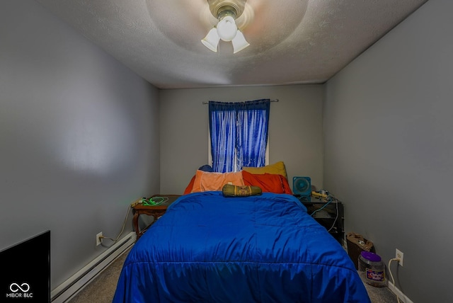 1905 W Brownstown Rd, North Vernon, IN 47265 - carpeted bedroom with a baseboard radiator, a ceiling fan, and a textured ceiling