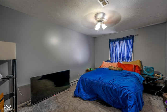 1905 W Brownstown Rd, North Vernon, IN 47265 - bedroom featuring carpet flooring, a textured ceiling, ceiling fan, and a baseboard radiator