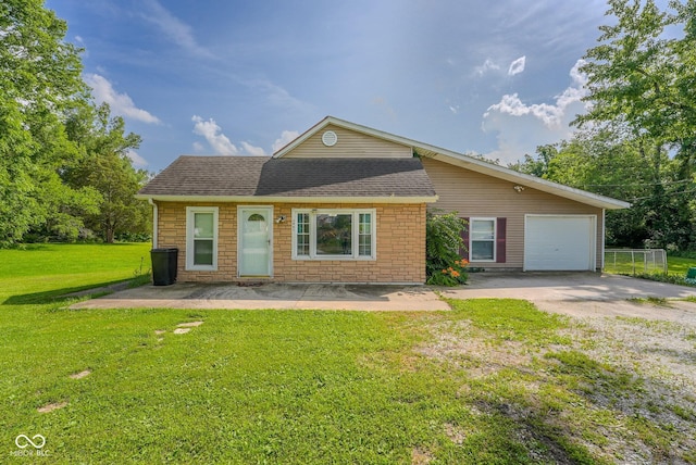 1905 W Brownstown Rd, North Vernon, IN 47265 - view of front of home with driveway, an attached garage, and a shingled roof