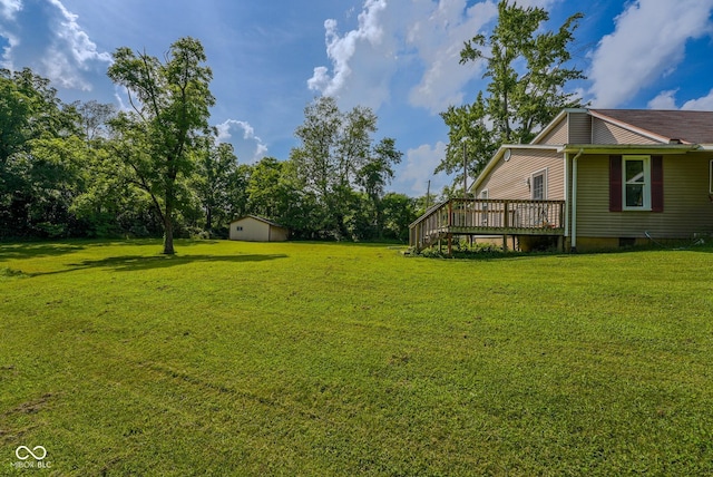 1905 W Brownstown Rd, North Vernon, IN 47265 - view of green lawn with a wooden deck and a storage shed
