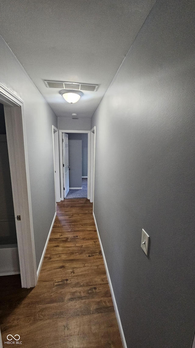 4614 Runyon Lake Dr W, Greenwood, IN 46143 - hallway featuring wood finished floors and baseboards