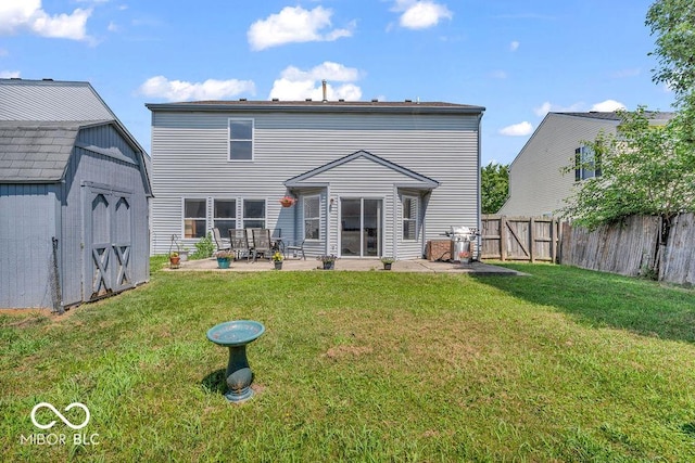 2309 Westmere Dr, Plainfield, IN 46168 - rear view of house featuring a patio area, a storage unit, a fenced backyard, and a gate