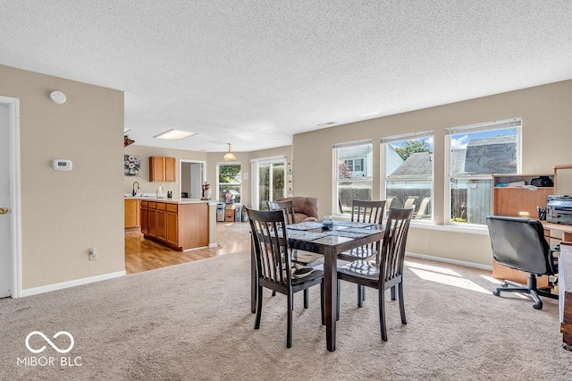2309 Westmere Dr, Plainfield, IN 46168 - dining space with light carpet, a textured ceiling, and an office area