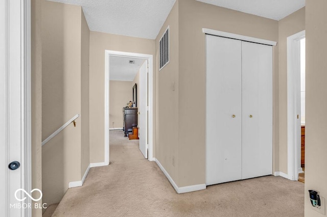 2309 Westmere Dr, Plainfield, IN 46168 - hallway with carpet floors and an upstairs landing