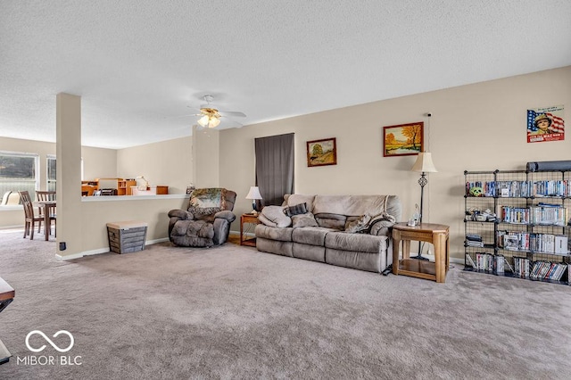 2309 Westmere Dr, Plainfield, IN 46168 - carpeted living area featuring ceiling fan and a textured ceiling