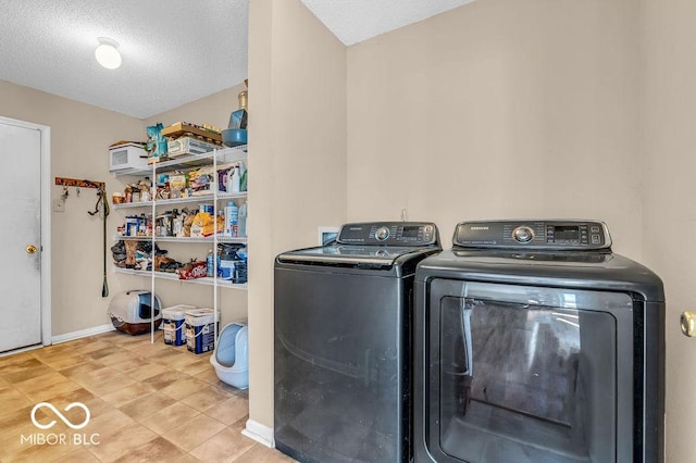 2309 Westmere Dr, Plainfield, IN 46168 - washroom featuring washer and dryer, a textured ceiling, and tile patterned floors