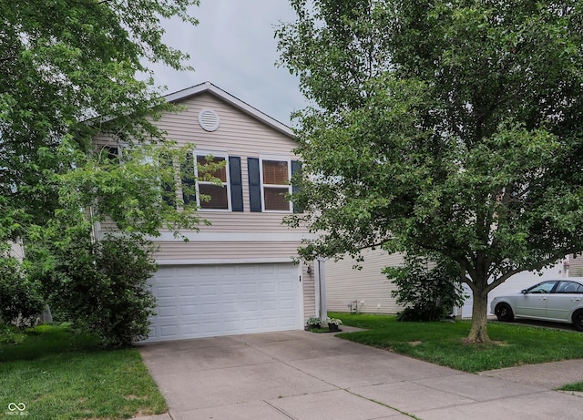 2355 Collins Way, Greenfield, IN 46140 - view of property hidden behind natural elements featuring an attached garage, driveway, and a front lawn
