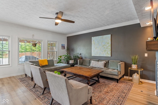 8754 Lily Ct, Zionsville, IN 46077 - living room featuring a textured ceiling, hardwood / wood-style floors, a ceiling fan, and ornamental molding