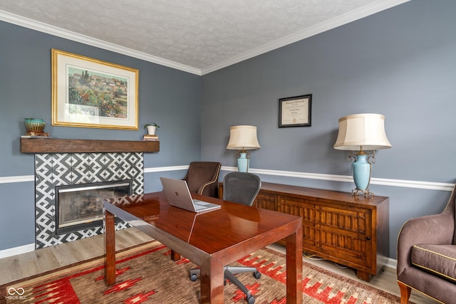 8754 Lily Ct, Zionsville, IN 46077 - office space featuring a fireplace, wood finished floors, a textured ceiling, and crown molding