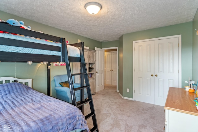 8754 Lily Ct, Zionsville, IN 46077 - bedroom featuring light carpet, a closet, and a textured ceiling