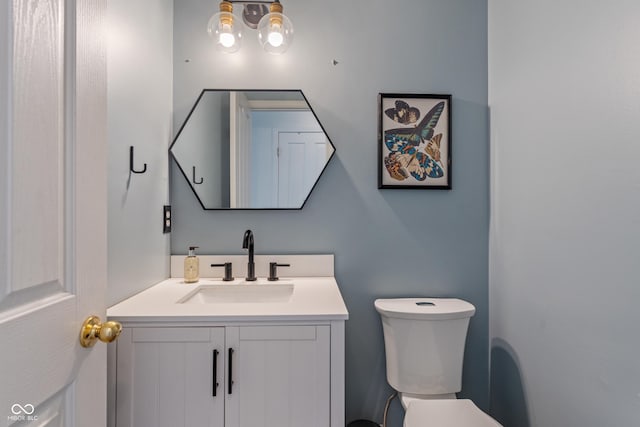 8754 Lily Ct, Zionsville, IN 46077 - half bathroom featuring vanity and toilet