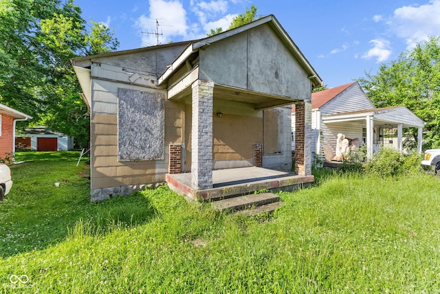 3335 W 9th St, Indianapolis, IN 46222 - rear view of house featuring a yard and a storage shed