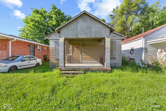 3335 W 9th St, Indianapolis, IN 46222 - back of property featuring an outdoor structure and stucco siding