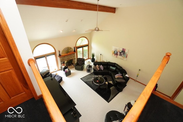 5586 S 200 E, Franklin, IN 46131 - living room with carpet flooring, beamed ceiling, a glass covered fireplace, high vaulted ceiling, and ceiling fan
