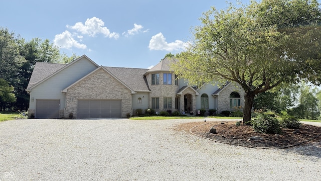 5586 S 200 E, Franklin, IN 46131 - french provincial home with gravel driveway, a garage, and a shingled roof