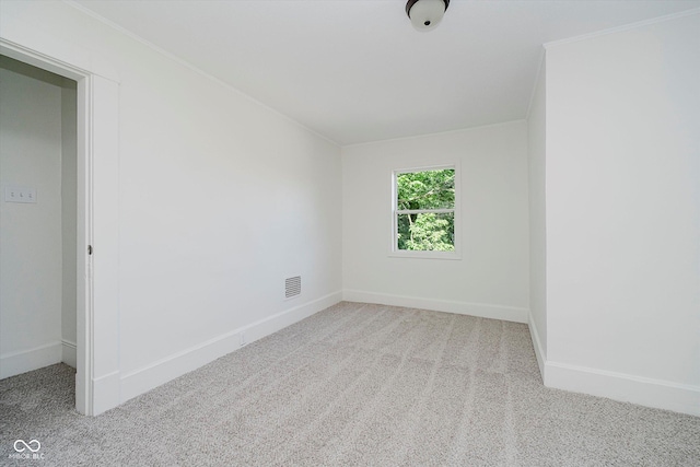 3709 Central Ave, Indianapolis, IN 46205 - carpeted spare room with ornamental molding