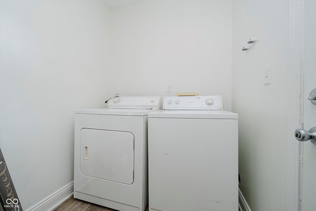 3709 Central Ave, Indianapolis, IN 46205 - laundry room with washer and clothes dryer and wood finished floors