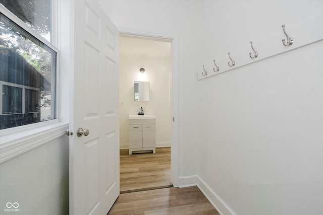3709 Central Ave, Indianapolis, IN 46205 - hall with light wood-style flooring and a sink